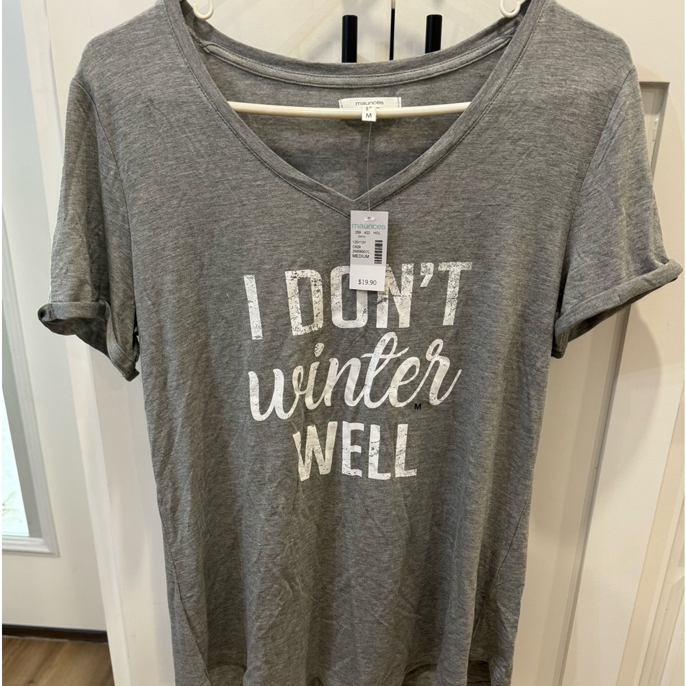 Women’s size medium. PTP 10” and stretches to 23”.